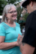 Sheryl listening on the street